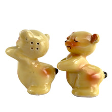Load image into Gallery viewer, Vintage hand painted yellow Snuggle Hugs hugging bears salt and pepper shakers. Designed by Ruth Van Tellinger, USA, 1940s. Add these adorable kitschy shakers to your collection!

In excellent condition, no chips/cracks/repairs. Impressed maker&#39;s mark on the bottom.

Measures 2 3/8 x 2 3/4 x 3 3/8 inches
