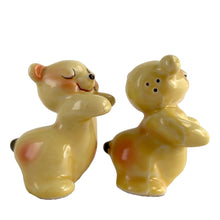 Load image into Gallery viewer, Vintage hand painted yellow Snuggle Hugs hugging bears salt and pepper shakers. Designed by Ruth Van Tellinger, USA, 1940s. Add these adorable kitschy shakers to your collection!

In excellent condition, no chips/cracks/repairs. Impressed maker&#39;s mark on the bottom.

Measures 2 3/8 x 2 3/4 x 3 3/8 inches

