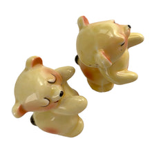 Load image into Gallery viewer, Vintage hand painted yellow Snuggle Hugs hugging bears salt and pepper shakers. Designed by Ruth Van Tellinger, USA, 1940s. Add these adorable kitschy shakers to your collection!

In excellent condition, no chips/cracks/repairs. Impressed maker&#39;s mark on the bottom.

Measures 2 3/8 x 2 3/4 x 3 3/8 inches
