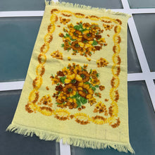 Load image into Gallery viewer, Pair of vibrant vintage yellow 100% cotton terry cloth hand towels featuring a floral pattern in yellow, ochre, brown and green finished with fringed edges. Crafted by Wabasso, Canada, circa 1970s. Deck out your home or cottage bath with the fabulous towels!  In excellent, like-new condition, free from tears/stains.  Measures 14 1/2 x 23 1/2 inches cottagecore retro
