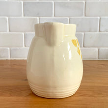Load image into Gallery viewer, Antique vintage art deco ceramic creamer pitcher 1504 featuring an impressed yellow window or thistle on pale yellow ground. Crafted by Robinson Ransbottom Pottery Co., USA, 1920s. A unique piece to add to your art pottery tableware collection!

In excellent condition, no chips/cracks/repairs, normal age-related crazing. Maker&#39;s marks.

Measures 4 1/2 x 3 1/4 x 4 1/4 inches
