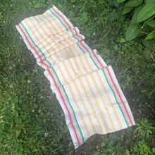 Load image into Gallery viewer, Vintage&nbsp;cream linen with yellow, red and green stripes deck chair fabric remnant. Made in France. Perfect for crafting and home decor projects.  In excellent condition, no stains/tears.  Measures 16 1/2 x 104 inches
