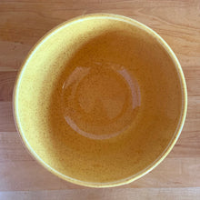 Load image into Gallery viewer, Vintage yellow speckled horizontal ribbed ceramic mixing bowl. Crafted by McCoy Pottery, 1950s. A rare piece to add to your art pottery collection!

In excellent condition, no chips/cracks/repairs. Age-related crazing. Typical manufacturing glaze pops. Maker&#39;s marks.

Measures 7 x 3 3/4 inches
