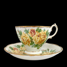 Load image into Gallery viewer, This vintage Tea Rose bone china teacup and saucer is so pretty! Both the Malvern shaped cup and saucer have a lovely scalloped edge with hand painted roses in shades of yellow and green with gold gilt rim. Crafted by Royal Albert, England, circa 1940s. A lovely addition to your teacup collection or to give as a gift!

In excellent condition, free from chips, cracks and repairs. Makers marks present.

Teacup measures 3 1/2 x 2 3/4 inches. Saucer measures 5 5/8 inches
