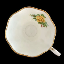 Load image into Gallery viewer, This vintage Tea Rose bone china teacup and saucer is so pretty! Both the Malvern shaped cup and saucer have a lovely scalloped edge with hand painted roses in shades of yellow and green with gold gilt rim. Crafted by Royal Albert, England, circa 1940s. A lovely addition to your teacup collection or to give as a gift!

In excellent condition, free from chips, cracks and repairs. Makers marks present.

Teacup measures 3 1/2 x 2 3/4 inches. Saucer measures 5 5/8 inches
