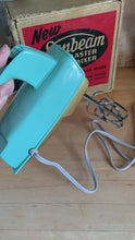 Load and play video in Gallery viewer, Vintage Sunbeam Turquoise Gold Mixmaster Hand Mixer, Sunbeam Corporation, Canada
