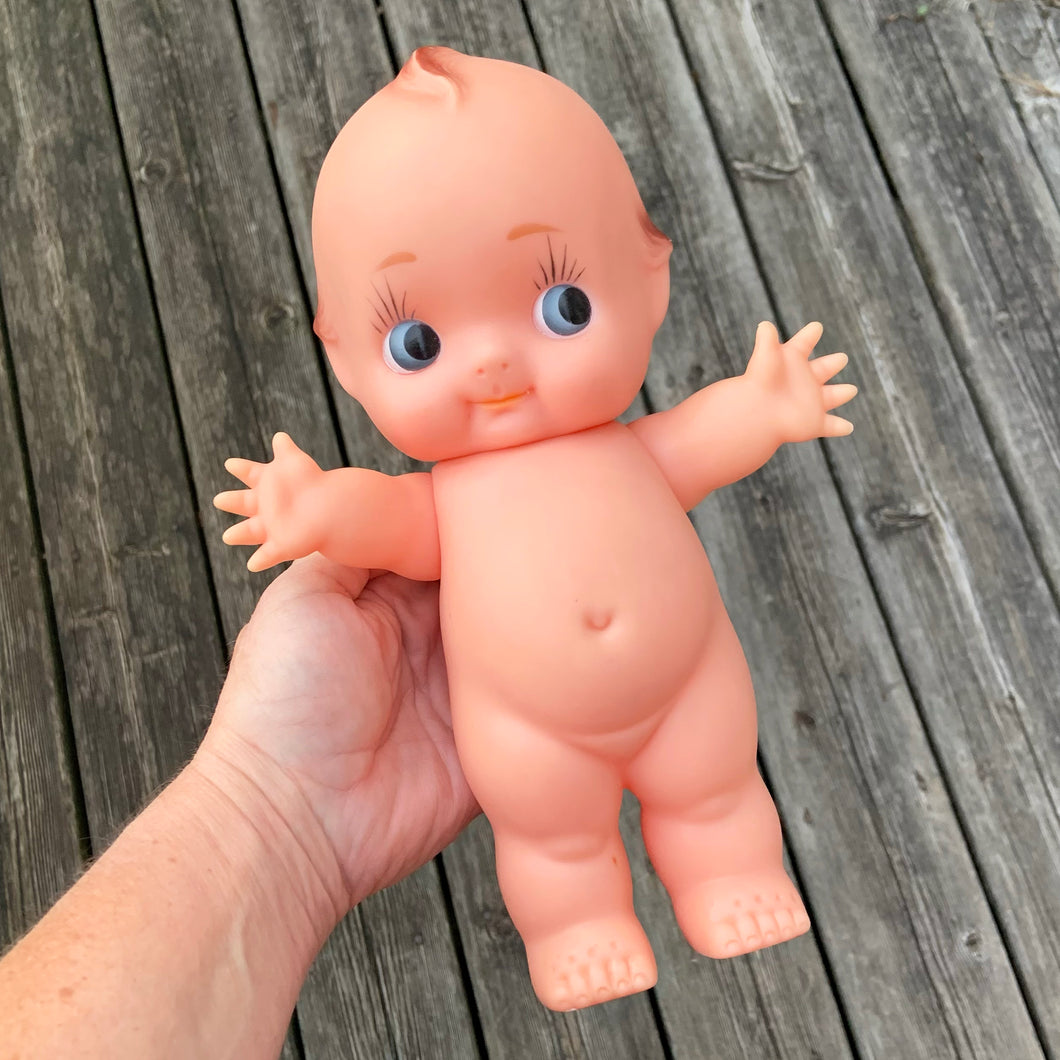 Collectible and kitschy rubber squeaky Kewpie Doll with green wings. This delightful little cutie stands at approximately 11
