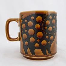 Load image into Gallery viewer, Perfect for your morning cuppa! This fabulous graphic vintage mug was designed by John Clappison and produced by Hornsea in England, circa 1975. The momma, daddy and baby pigs are decorated with dots and flowers....so sweet and highly collectible!  In excellent condition free from chips/cracks.  Measures 3&quot; x 3-1/2&quot;  Capacity 10oz
