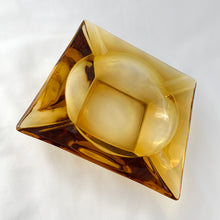 Load image into Gallery viewer, Vintage Retro Mid-century Mid Century Modern Large Square Pressed Glass Amber Gold Honey Amber Yellow Ashtray Anchor Hocking USA Cigarette Cigar Cigarello Joint Blunt Marijuana Home Decor Smoking Smoke Smoker Tobacciana Unique Gift Home Decor Glassware Tableware Freelton Hamilton Antique Mall Toronto Canada shop store community seller reseller vendor
