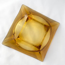 Load image into Gallery viewer, Vintage Retro Mid-century Mid Century Modern Large Square Pressed Glass Amber Gold Honey Amber Yellow Ashtray Anchor Hocking USA Cigarette Cigar Cigarello Joint Blunt Marijuana Home Decor Smoking Smoke Smoker Tobacciana Unique Gift Home Decor Glassware Tableware Freelton Hamilton Antique Mall Toronto Canada shop store community seller reseller vendor
