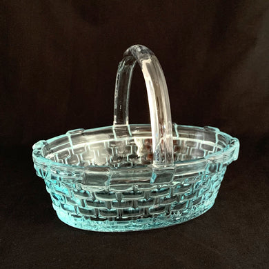 Adorable aqua pressed glass basket, featuring a basketweave pattern with clear handle. The perfect accessories to amp up your Easter decor, or use as a catchall.  In excellent condition, free from chips/cracks.  Measures 7 x 5 1/8 x 5 1/2 inches
