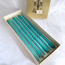Load image into Gallery viewer, vintage fifteen inch Baroque Slim Twist wax Candles in aqua turquoise with the product code is number 615. The ten candles are in their original box with six in the plastic sleeves. The box notes these as &quot;another PARAGON® creation&quot;. Produced by Victrylite Candle Co. in Oshkosh, Wisconsin USA, circa 1950s/1960s. You&#39;ll find this phrase printed on each side of the box, &quot;light your evenings with loveliness...&quot; and they are spot on. In excellent vintage condition with wicks intact in original box.
