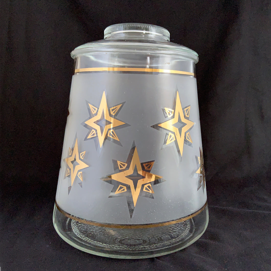 Vintage Glass Canister with Clear and Frosted Glass with Gold Atomic Stars Anchor Hocking Bartlett Collins Tableware Glassware Home Decor Boho Bohemian Shabby Chic Cottage Farmhouse Victorian Mid-Century Modern Industrial Retro Flea Market Style Unique Sustainable Gift Antique Prop GTA Eds Mercantile Hamilton Freelton Toronto Canada shop store community seller reseller vendor Collector Collection Collectible