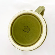 Load image into Gallery viewer, Graphic vintage mid-century era mug is glazed in avocado green and has a lovely impressed flower pattern. Produced by Noritake of Japan for Gift Craft Importers in Toronto, circa 1960s.  In excellent condition, free from chips/cracks.  Measures 3 1/8 x 3 1/2 inches
