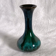 Load image into Gallery viewer, The pride of Collingwood, Ontario, Blue Mountain Pottery! This lovely bud vase will compliment and floral bouquet. Typical with BMP pottery, it has a drip glaze finish in deep greens and black.   Excellent condition, no chips or cracks.  Size: 3&quot; x 5.5&quot;
