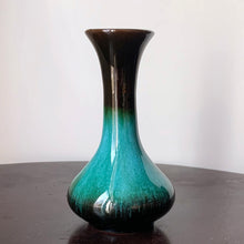 Load image into Gallery viewer, The pride of Collingwood, Ontario, Blue Mountain Pottery! This lovely bud vase will compliment and floral bouquet. Typical with BMP pottery, it has a drip glaze finish in deep greens and black.   Excellent condition, no chips or cracks.  Size: 3.25&quot; x 5.5&quot;
