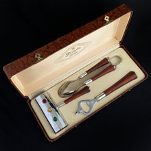 Load image into Gallery viewer, Three-piece set of mid-century vintage Barmates stop light cocktail bar tool accessories. Presented in original satin lined box and the tools look brand new. Set includes red Danger, yellow Caution and green Go handled 3 oz. jigger, ice tongs and opener. Each piece has a gorgeous dark amber bakelite handle and the chrome on each piece is magnificent. Produced by Glo-Hill of Canada, circa 1950. A truly stunning bar tool set! In excellent condition. Box measures 12 3/8 long by 4 3/4 wide by 2 1/4 high.
