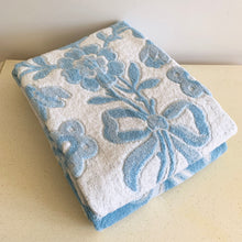 Load image into Gallery viewer, Vintage tone-on-tone blue and white bath towel with floral pattern and tied fringe edge.  In excellent condition, free form tears/stains.  Measures 28 1/2 x 54 inches
