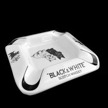 Load image into Gallery viewer, Cool vintage promotional ashtray for &quot;Black &amp; White&quot; Scotch Whiskey with a pair of Scotty dogs. Produced by Arklow in Ireland.  In excellent condition, free from chips/cracks.  Measures 5-3/8&quot; x 5-3/8&quot;
