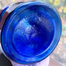 Load image into Gallery viewer, Fantastic cobalt blue liquor decanter with bubble design and stopper. Made in Taiwan, circa 1970.  In good vintage condition, no chips or cracks, small manufacturer&#39;s defect on the decanter&#39;s side from a burst air bubble.  Measures 8&quot;
