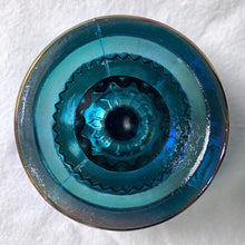 Load image into Gallery viewer, This vintage round pedestal compote in the &quot;Crown&quot; pattern is crafted of beautiful iridescent blue carnival glass. Manufactured by Colony (Indiana Glass Co.) circa 1960/70s. Serves as a stylish dish for candy or nuts. Alternatively, use it to organize items on a bathroom vanity or desk. This piece is highly versatile and adds a bit of shimmer to any decor style.    In excellent condition free from chips or cracks.  Measures 5 x 5 1/4 inches
