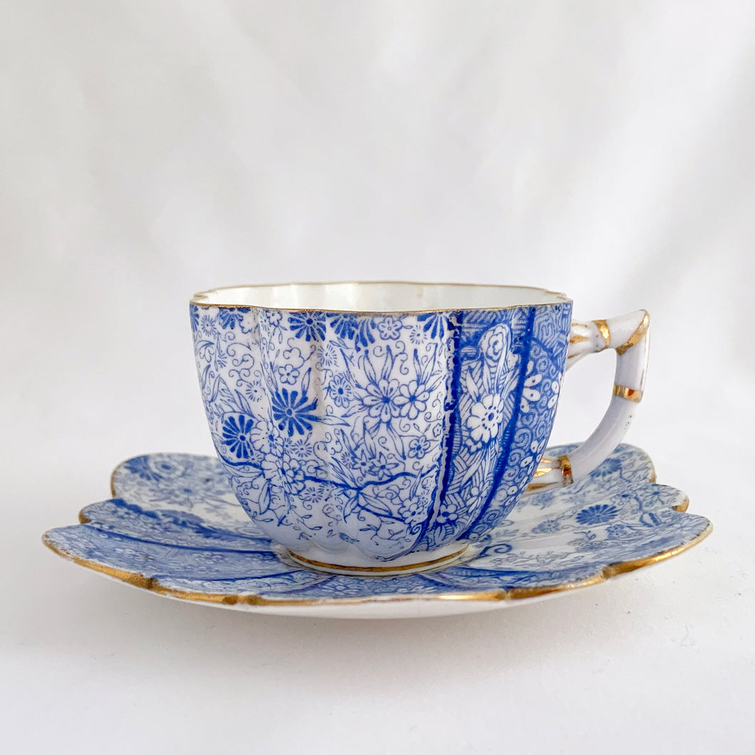 Rare and beautiful antique shell-shaped bone china, demitasse cup and saucer in the complex 