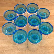 Load image into Gallery viewer, A recent treasure hunt uncovered this stunning set of eight (8) mid-century Italian-made parfait glasses (circa 1950-60). The blue is reminiscent of the Mediterranean Sea with its azure coloured water. Imagine eating a scrumptious tiramisu from these lovelies at a seaside café. They are simply stunning!  All are in excellent vintage condition, no chips or cracks. Marked &quot;Italy&quot;.  Size: 2.25&quot; x 6&quot;
