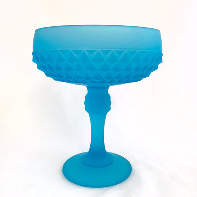 Vintage Diamond Point blue satin glass compote. Crafted by Indiana Glass, USA, 1970 - 1990. Fill with your favourite candies. Easily repurpose as a bathroom vanity compote to hold cotton balls or bath bombs, or use as a catchall.

In excellent condition, no chips.

Measures 6 1/4 x 7 1/8 inches