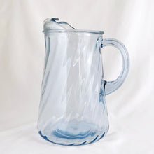 Load image into Gallery viewer, We are digging the blue optic swirl of this vintage glass ice lip pitcher. Produced by the Bartlett Collins Glass Company, circa 1970. Perfect for serving water, lemonade, iced tea or your favourite cocktails.  In excellent condition, no chips or cracks.   Measures  5 3/4 x 9 1/4 inches
