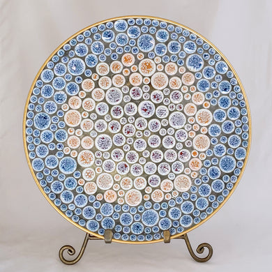 A lovely vintage mid-century mosaic tile dish in shades of blue, purple and rust on white multi-sized round shaped tiles. Perfect as wall art or a dish. A great retro decor piece from the 50s!   In excellent condition.  Measures 12