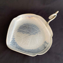 Load image into Gallery viewer, This vintage mid-century modern figural dish in the shape of a leaf features a curled handle a saw-toothed edge. Crafted by BW Buenilum, USA, circa 1950s. Use as a candy dish, or catchall. The perfect additional to your fall decor!  In good vintage condition with some surface marks and normal age-related wear  Measures 8 3/4 x 6 1/2 inches. Maker&#39;s mark on bottom.
