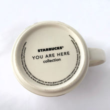 Load image into Gallery viewer, Perfect for your morning cuppa joe, eh? This fabulous collectible CANADA mug was produced by Starbucks as part of their &quot;You Are Here&quot; collection, 2012.  Excellent condition, free from chips/cracks/repairs.  Measures 3-7/8&quot; x 3-1/2&quot; and holds 14 ounces.

