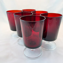 Load image into Gallery viewer, This beautiful set of six vintage &quot;Cavalier Ruby&quot; water goblet glasses are a luscious deep ruby red with clear footed crystal stems. Made by Cristal D&#39;Arques-Durand, France. Circa 1970. These are great for water and wine or use to dessert parfaits.  Each glass is in excellent condition, no chips or cracks. Marked &quot;France&quot; on the bottom.  Measures 3 x 5 1/8 inches  Capacity 8 ounces
