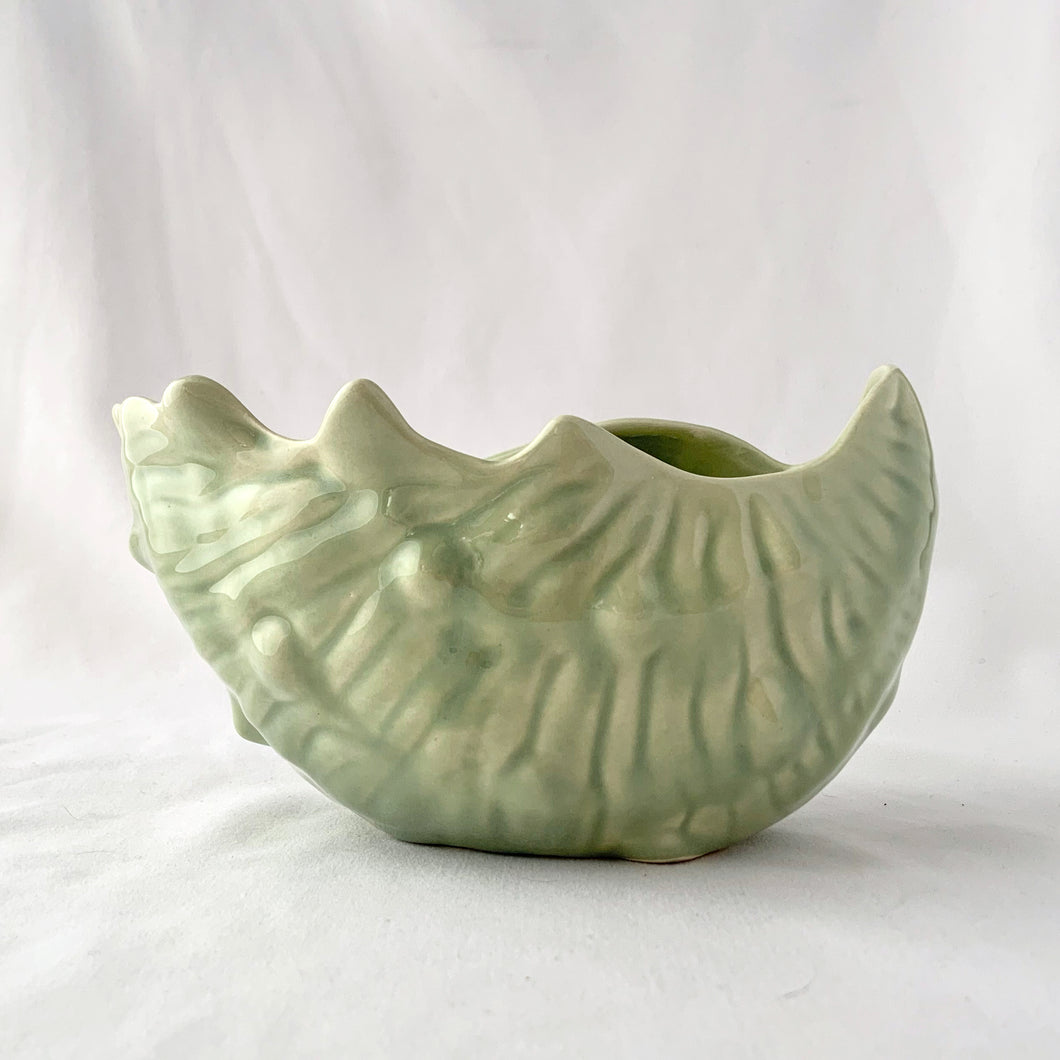 Vintage Celadon blue green glazed ceramic pottery seashell planter. Produced by UFC, Canada, circa 1970s. The perfect colour and shape for coastal decor. May be used for small houseplants, succulents or as decor piece.  In excellent condition, free from chips/cracks/repairs.   Measures 7 x 4 5/8 x 4 inches