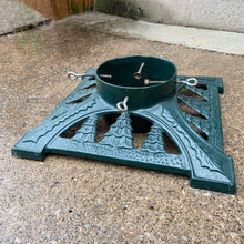 Load image into Gallery viewer, Get ready to put up the Christmas tree using this gorgeous cast iron stand in hunter green, decorated with Christmas trees! The perfect addition to your vintage or modern Christmas decor. Made by the John Wright Company  In good vintage condition.  Measures 14&quot; x 14&quot; and holds a tree with up to a 6&quot; diameter, super sturdy and heavy base with water reservoir.

