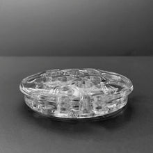 Load image into Gallery viewer, Vintage clear glass flower frog with narrow rim and 11 holes.  In good vintage condition, smooth chip to the underside of the rim.  Measures 3 1/2 x 5/8 inches
