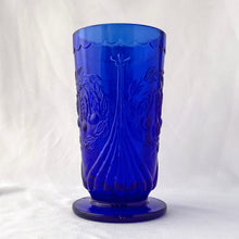 Load image into Gallery viewer, RARE FIND! Charming vintage cobalt blue Cherry 7-15 iced tea footed glass tumblers. Produced by the LG Wright Glass Company, USA, circa 1960s. The pattern consists of a trio of cherries surrounded by a wreath pf leaves bordered by a fluted design and a scalloped detail below the rim. In great vintage condition. One glass has a manufacturer&#39;s defect at the base, one glass has minor flea bites at the rim. The others are in excellent condition, free from chips/cracks.
