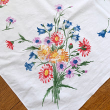 Load image into Gallery viewer, Lovely vintage linen tablecloth with a colourful flower bouquets in shades of pink, yellow, blue, purple and green.  In good vintage condition, free from tears, minor stains.  Measures 49&quot; x 61&quot;
