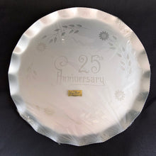 Load image into Gallery viewer, Celebrate that 25th anniversary milestone with this elegant tray, etched by WJ Hughes in 12-petalled Corn Flower pattern. The blank tray was made by Silhoutte, Canada, circa 1970. This gorgeous serving tray would look incredible on a bar cart,  dining table or buffet! Rarely do we find a piece like this in its original packaging. Makes a great gift!  In new condition in the original packaging with the &quot;GENUINE CORN FLOWER BY W.J. HUGHES&quot; sticker still affixed to the wrapper.  Measures 13 inches
