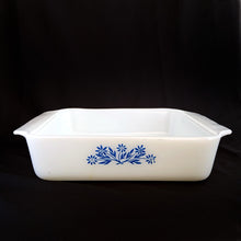 Load image into Gallery viewer, Fabulous find, in this vintage &quot;Blue Cornflower&quot; 435 white milk glass square baking dish. Produced by Anchor Hocking, circa 1970s.  In excellent condition, free from chips/cracks.  Measures 8-5/8&quot; x 8-5/8&quot; x 2-1/4&quot; 
