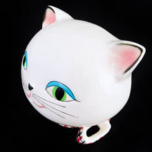 Load image into Gallery viewer, Adorable vintage mid-century kitschy Cozy Kitten wall mounted string and scissor holder. This ceramic white cat holds a ball of string which can be threaded through the mouth along with a pink, black and white checked collar with bow for holding scissors. Produced by Holt Howard, Japan, 1958.  In vintage condition, no chips. Although there are two cracks on this piece, it will still look great mounted on the wall or sitting on a shelf to complement your kitsch decor.  Measures 5 x 4 inches
