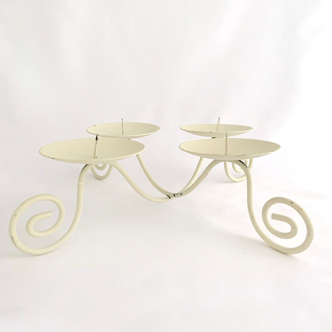 Painted cream, iron candle holder with 4 platforms, circa 1970.   In excellent vintage condition.  Measures 10 x 10 x 2 1/2 inches