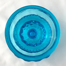 Load image into Gallery viewer, This classic vintage round compote in the &quot;Crown&quot; pattern in striking sapphire blue glass makes a great elevated dish for candy, nuts, or repurpose on a bathroom vanity to hold cotton balls or bath bombs. We use these in our office to hold paper clips and rubber bands. A versatile and elegant piece of pressed glass to add some sparkle to any home decor style!  In excellent condition, no chips or cracks. Maker is Colony (Indiana Glass Company) USA, circa 1960-1970.  Measures 5 x 5 1/4 inches

