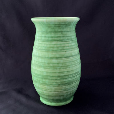 Vintage green glazed horizontally ribbed art pottery flower vase. Shape 129. Crafted by Crown Ducal Ware, England, circa 1930s. Create a beautiful flower arrangement with this vessel! In excellent condition, free from chips/cracks/repairs. Maker's mark on the bottom. Measures 5 x 9 inches