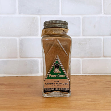Vintage glass bottle of Pure Gold pure currie powder. Produced by Pure Gold Manufacturing Co. Limited, Canada. Circa 1950s.  Partially used. Glass and label are in excellent condition.  Bottle Measures 1 1/2 x 4 inches