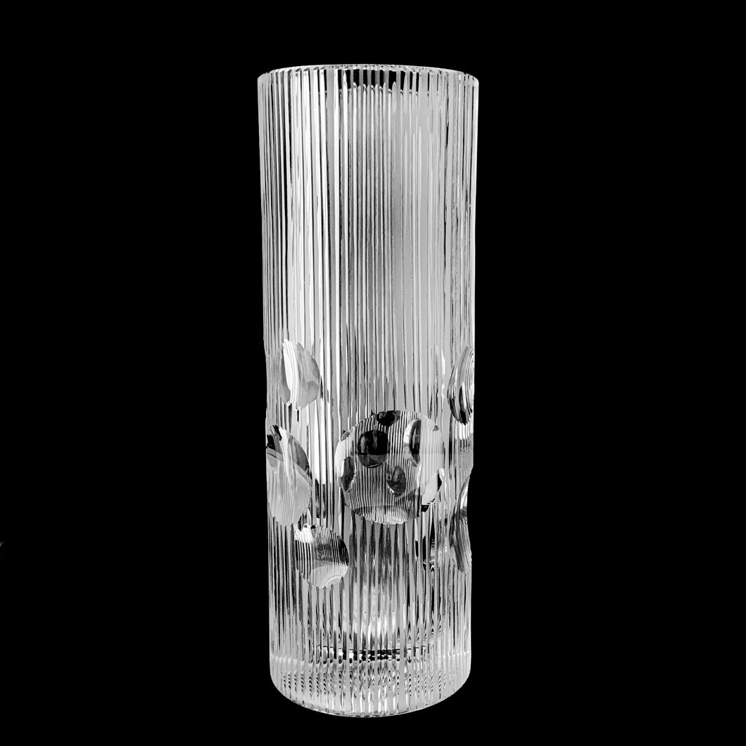 vintage modernist style twenty-four percent lead crystal vase cut in vertical ridges with a band of varying sized circles. The cut circles create an interesting kaleidoscope-like effect. A brilliant piece of art glass designed and executed by artist Josef Pravec, produced for Crystal BOHEMIA in Podebrady, Czechoslovakia, circa 1974. In excellent condition, free from chips, cracks or damage. Signed by the artist on the bottom. Measures 4-5/8