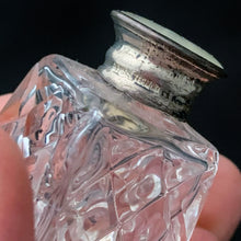 Load image into Gallery viewer, A vintage set of two traditional cut crystal pyramid shaped salt and pepper shakers in the art deco style with sterling silver and mother of pearl lids.   In excellent condition, no chips or cracks. Marked BIRKS STERLING on the lid.  Measures 1-1/4&quot; x 1-3/4&quot;
