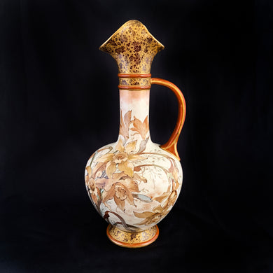 Stunning antique porcelain ewer or pitcher with hand painted daffodils (narcissus) in earthtones, purple and yellow lilies, gold on deep burgundy floral transferware decorate the top and foot. Produced by Royal Doulton, Burslem England. This piece dates between 1886 - 1902. A lovely piece to add to your decor!  In used condition, with a repair one side of the pouring lip. Otherwise no issues. Stamped Royal Doulton mark and impressed with 8566 BURSLEM and painted mark A.2941.  Measures 4 x 9 3/4 inches