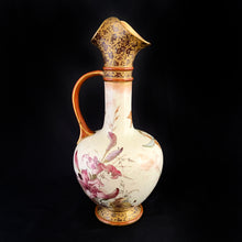 Load image into Gallery viewer, Stunning antique porcelain ewer or pitcher with hand painted daffodils (narcissus) in earthtones, purple and yellow lilies, gold on deep burgundy floral transferware decorate the top and foot. Produced by Royal Doulton, Burslem England. This piece dates between 1886 - 1902. A lovely piece to add to your decor!  In used condition, with a repair one side of the pouring lip. Otherwise no issues. Stamped Royal Doulton mark and impressed with 8566 BURSLEM and painted mark A.2941.  Measures 4 x 9 3/4 inches
