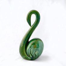 Load image into Gallery viewer, This graceful swan figurine is finished with a vibrant green drip glaze. Made by Delicean Pottery, mold shape A12.  In vintage condition, heavily crazed with one minor chip and crack at the bottom, neither of which detract from the beauty of this figurine.  Measures 7 inches

